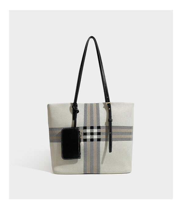 Large structured plaid check tote bag with smooth tan leather-look shoulder straps, attached front zip pouch, and gold-tone