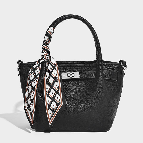 Kleine, formstabile Henkeltasche aus genarbter Optik in Taupe mit zwei Tragegriffen, bedrucktem Schalband, Drehverschluss vorne und Detailansicht