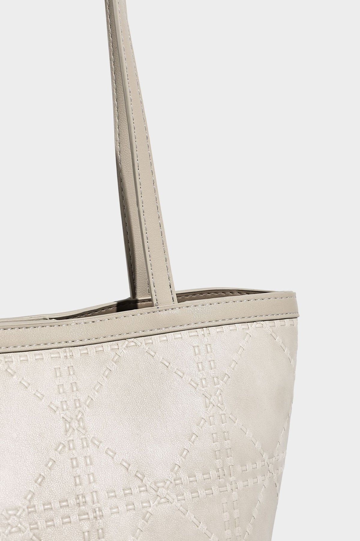 Quilted diamond-pattern tote bag with attached front zip pouch and long shoulder straps, detail view 21