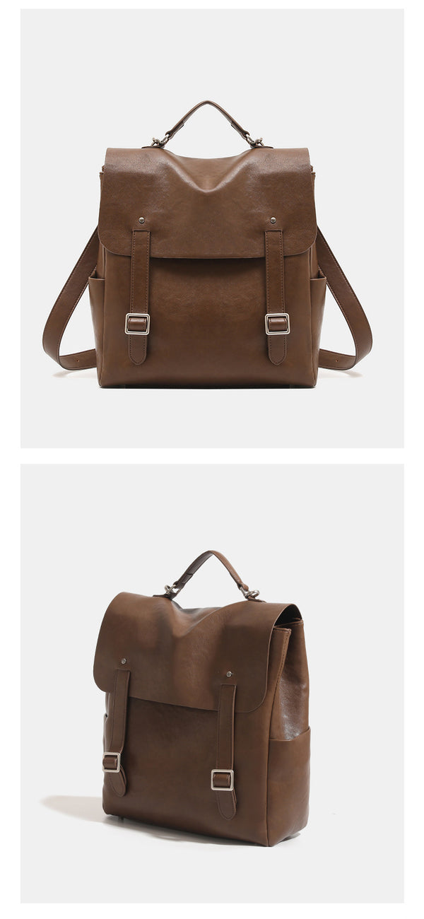 Structured flap backpack handbag in smooth leather-look finish with buckle front pocket, top handle, and silver-tone