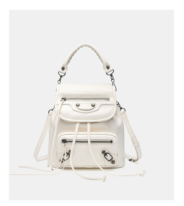 Small structured glossy leather-look convertible backpack handbag in black with flap closure, front zip pockets, metal stud