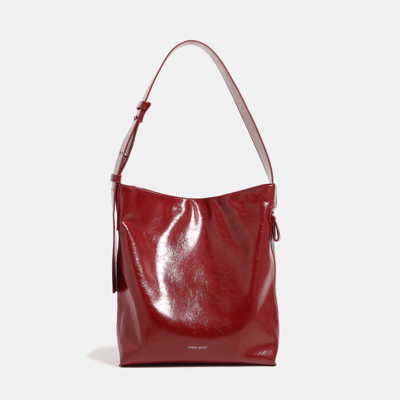 Glossy leather-look oversized shoulder tote bag with wide flat strap and soft rectangular silhouette, detail view 7