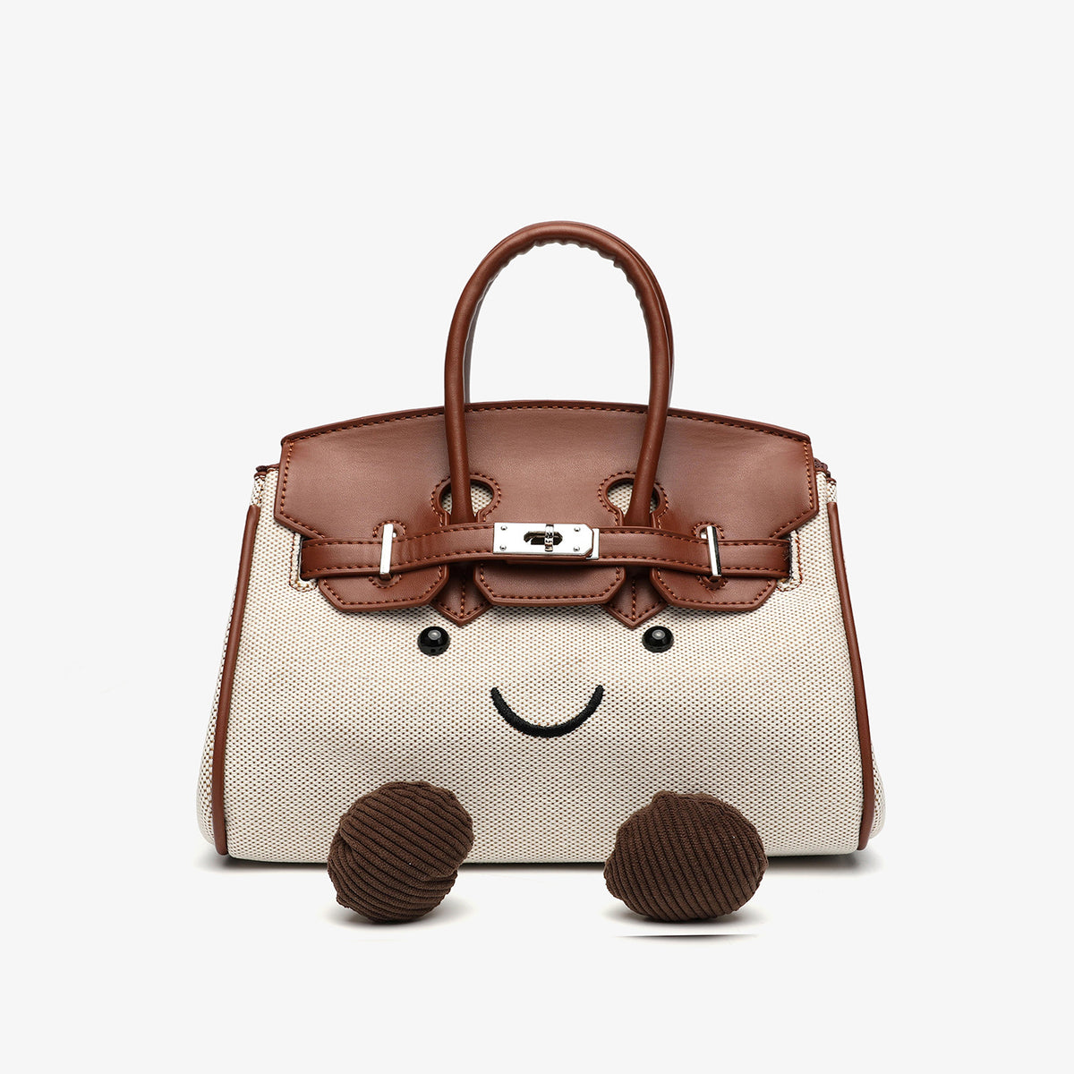 Small structured trapezoid satchel bag with smiling face motif, pom-pom accents, brown leather-look trim, silver-tone, detail