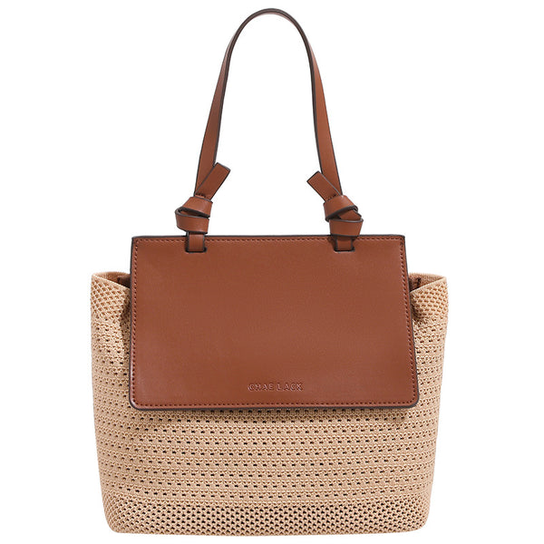 Structured woven tote bag with smooth leather-look front flap panel, knotted top handles, and detachable crossbody strap