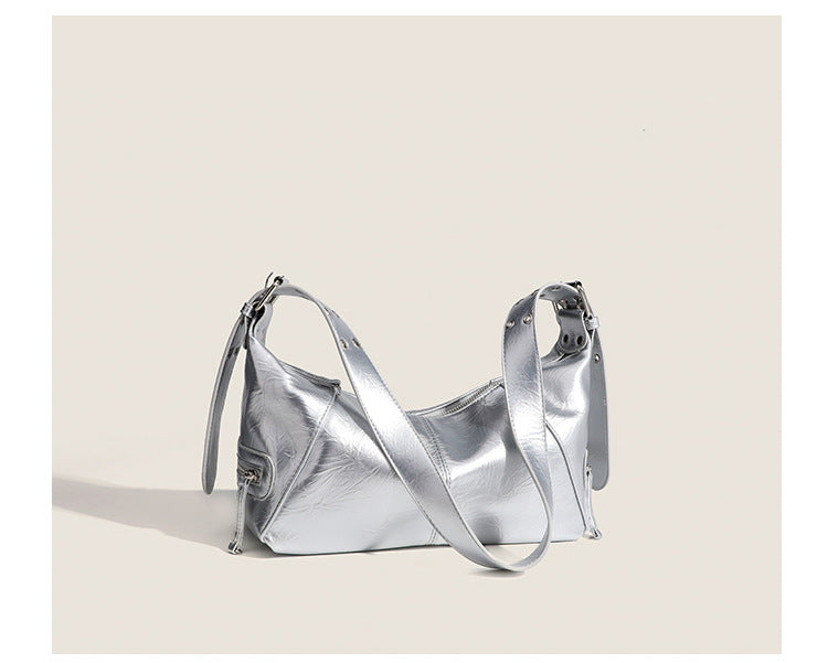 Glossy crinkled mini hobo shoulder bag with studded adjustable strap and silver-tone hardware, detail view 11