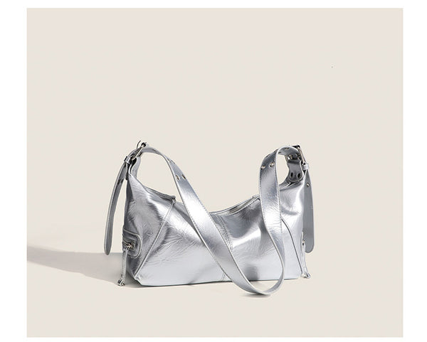 Glossy crinkled mini hobo shoulder bag with studded adjustable strap and silver-tone hardware, detail view 11