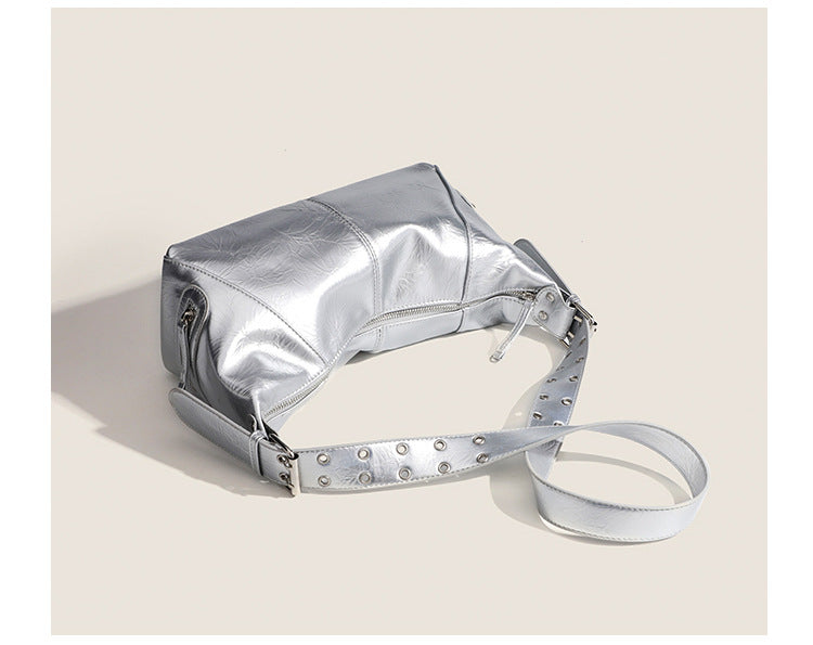 Glossy crinkled mini hobo shoulder bag with studded adjustable strap and silver-tone hardware, detail view 13