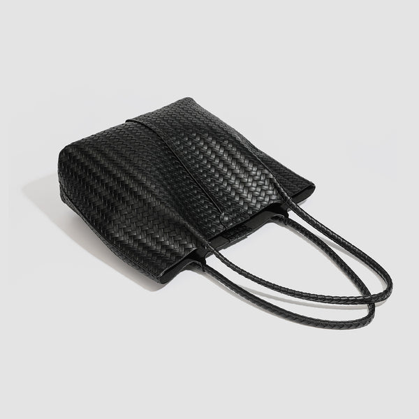 Large black basket-weave leather-look tote bag with long braided shoulder straps and matching woven zip pouch, detail view 4