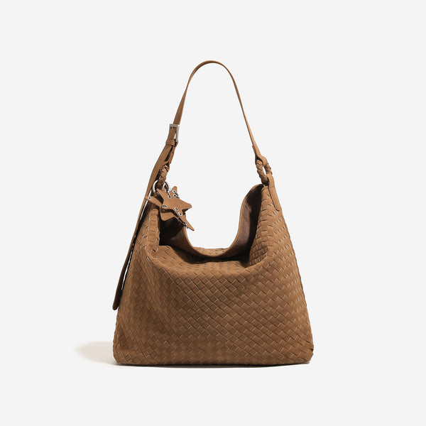 Slouchy woven hobo shoulder bag with matte suede-like finish, adjustable strap, and star charm hardware, detail view 8