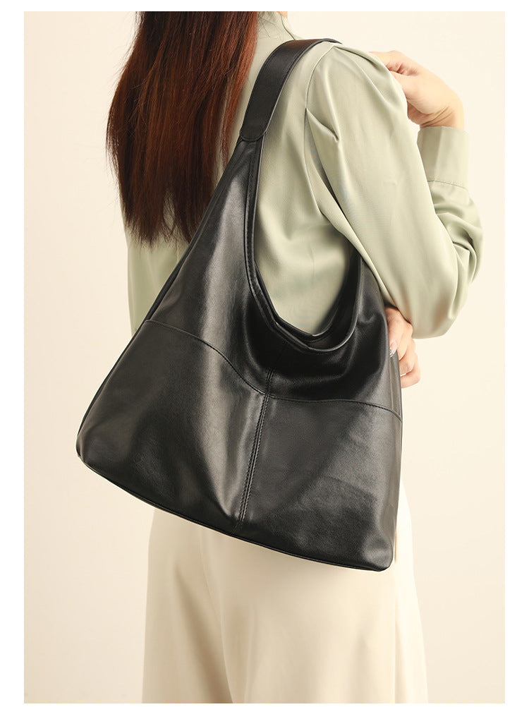 Oversized slouchy hobo tote bag in dark brown smooth matte leather-look finish with long flat shoulder strap and panelled