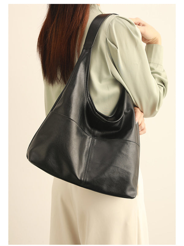 Oversized slouchy hobo tote bag in dark brown smooth matte leather-look finish with long flat shoulder strap and panelled
