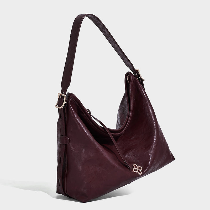 Slouchy leather-look hobo shoulder bag with gold-tone hardware and adjustable strap in brown, detail view 17