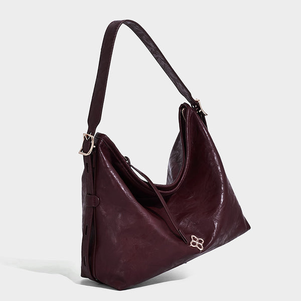 Slouchy leather-look hobo shoulder bag with gold-tone hardware and adjustable strap in brown, detail view 17