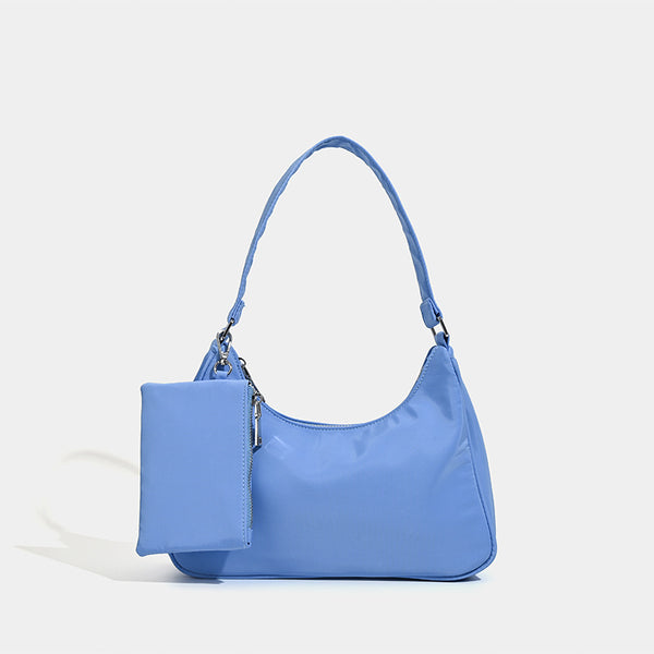 Curved hobo shoulder bag with detachable zip pouch in matte-satin finish with silver-tone hardware, detail view 8