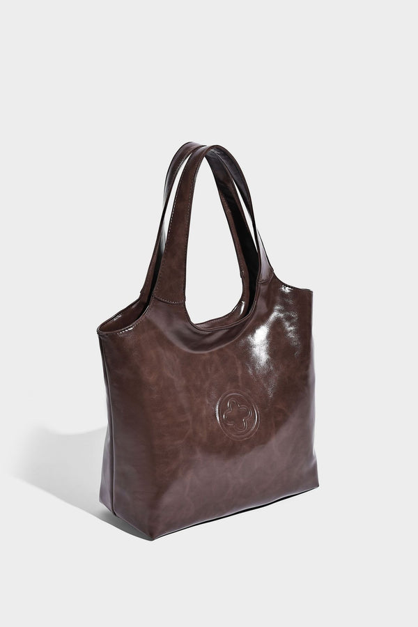 Glossy oil-wax leather-look open-top tote shoulder bag with embossed circular logo and long double straps, detail view 23