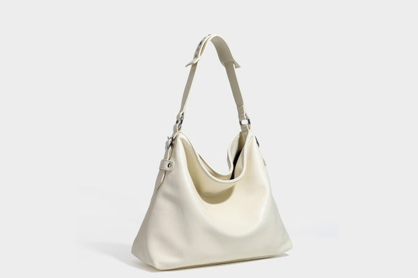 Large slouchy hobo shoulder bag in dark brown with smooth leather-look finish, adjustable strap, and silver-tone hardware