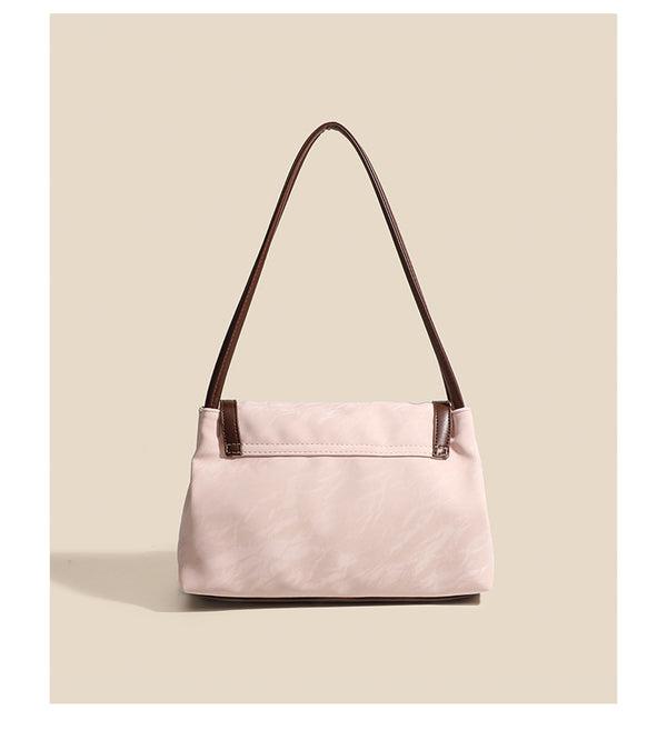 Structured crinkle-finish flap shoulder bag with butterfly metal appliqué and dark brown contrast trim, detail view 9