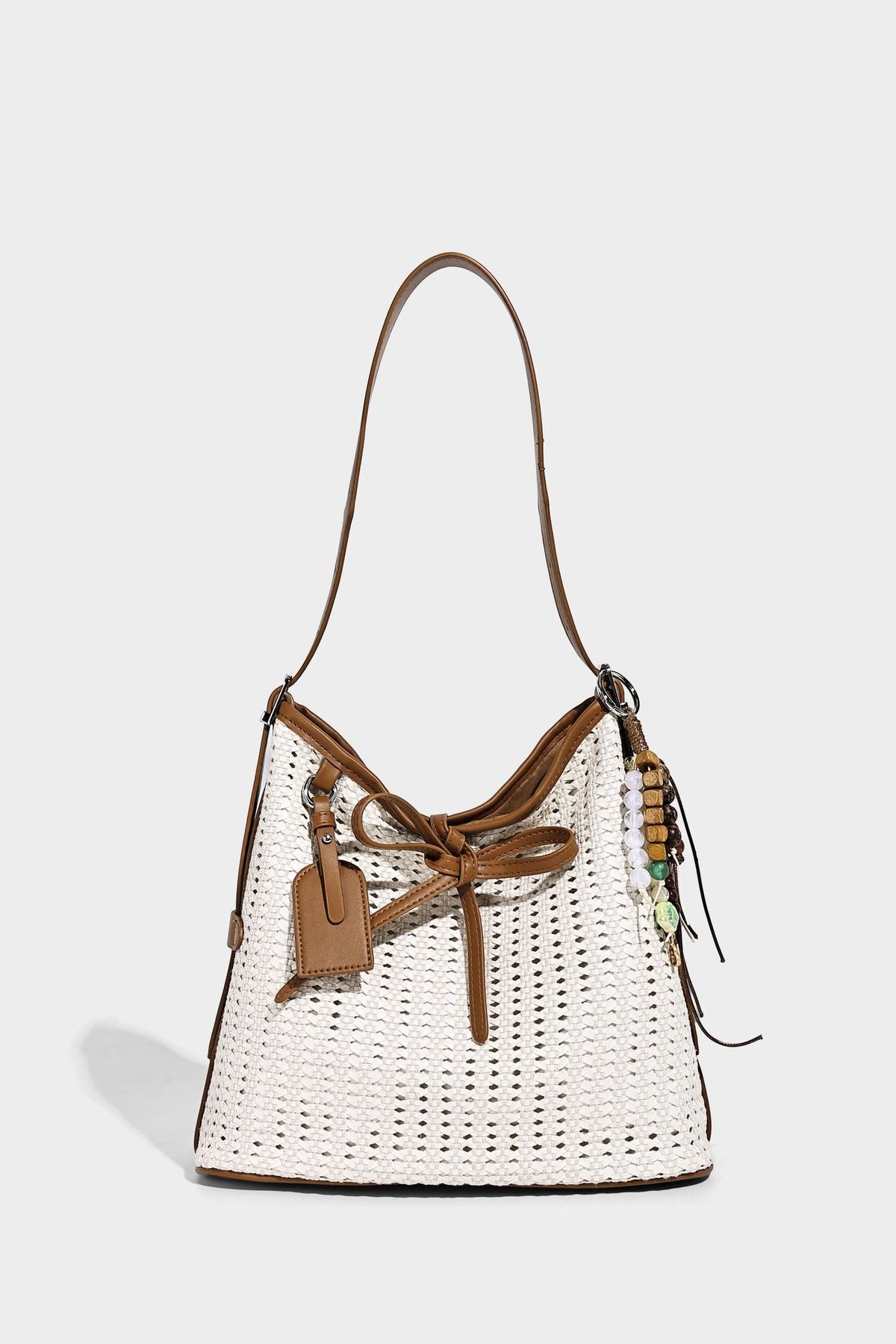 Slouchy open-weave shoulder tote bag with leather-look tan trim, tie-front closure, and long adjustable strap, detail view 8