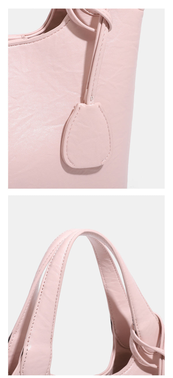 Soft glossy leather-look bucket tote bag with twin handles and detachable crossbody strap, detail view 15