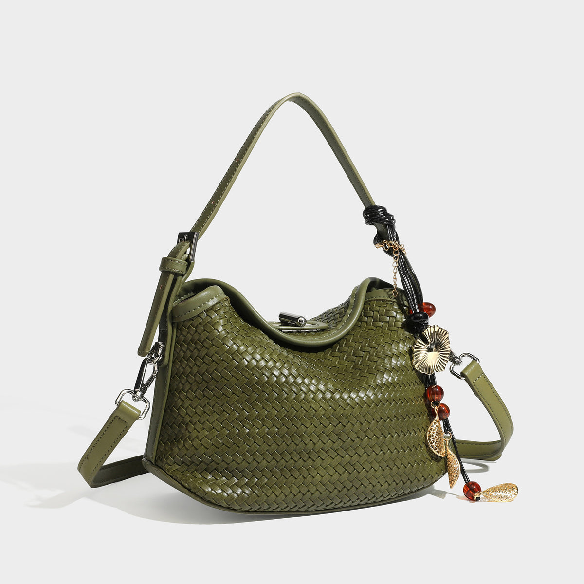 Small woven-look leather-look flap shoulder hobo bag in burgundy with silver-tone hardware and decorative tassel charm