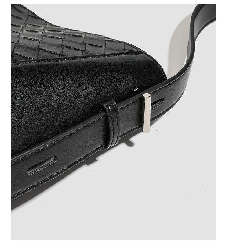 Large black bucket shoulder bag with diamond woven leather-look front panel, smooth side panels, magnetic snap closure, and