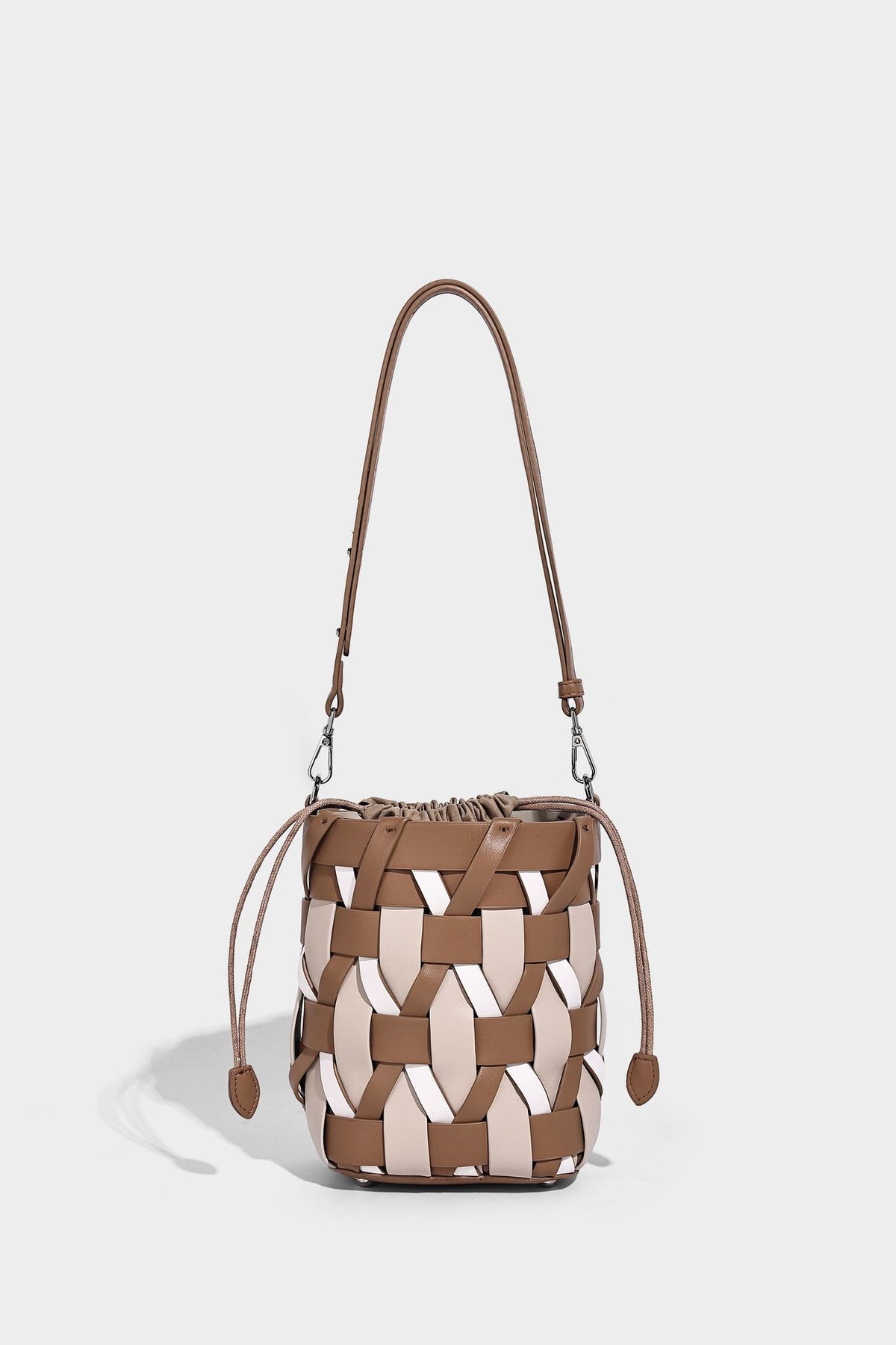 Small woven lattice bucket bag in tan and cream leather-look strips with drawstring top and detachable crossbody strap
