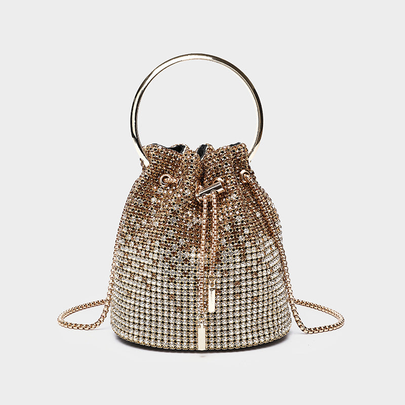 Small crystal rhinestone bucket bag with silver-tone ring handle and chain shoulder strap, drawstring closure, front view