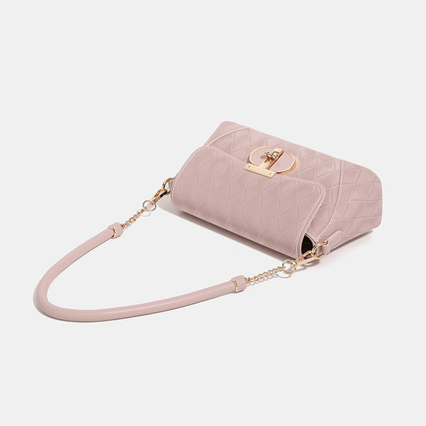 Small structured diamond-quilted flap bag with gold-tone turn-lock closure, chain shoulder strap, and cylindrical top handle