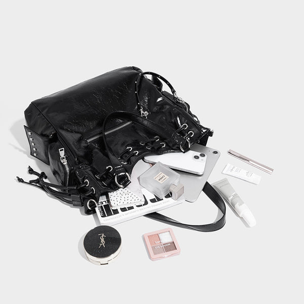 Glossy crinkled leather-look tote bag with silver grommet lace-up front detail, dual top handles, and detachable shoulder