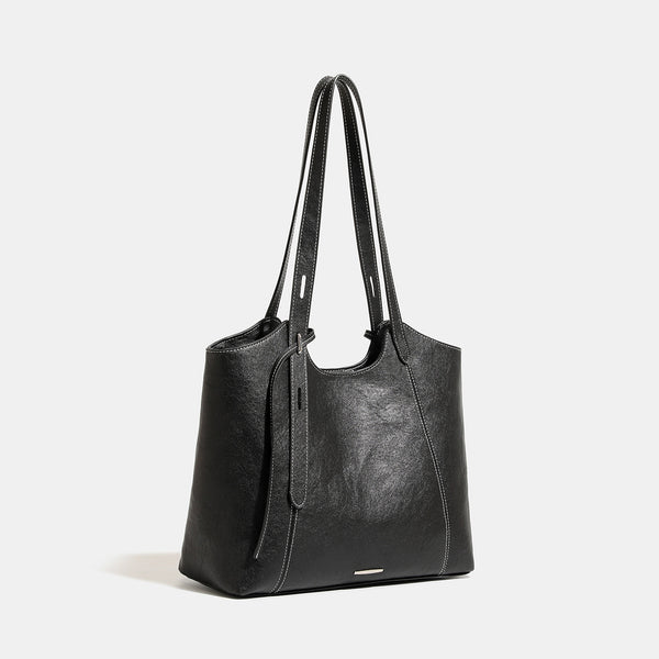 Structured open-top leather-look tote bag with long shoulder straps, contrast stitching, and side tie details, detail view 3