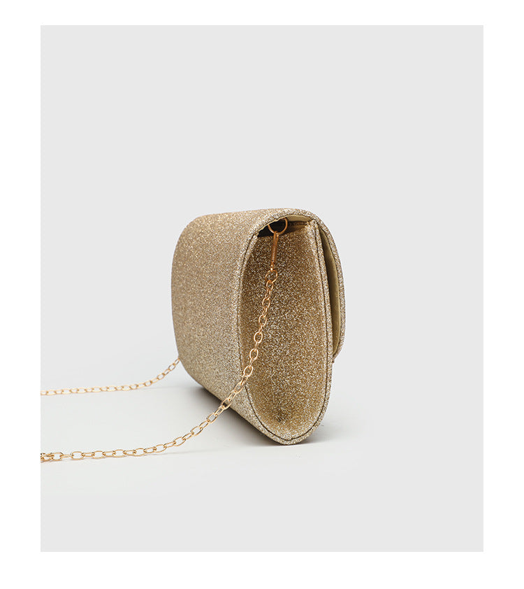 Structured glitter envelope clutch bag with gold-tone V-bar hardware and detachable chain strap, detail view 11