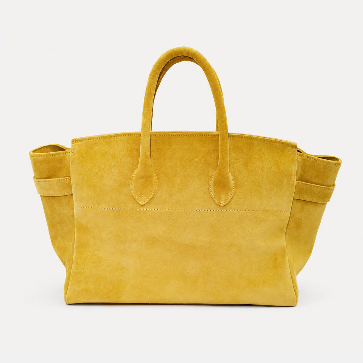 Large structured trapezoid tote bag in matte suede-like finish with dual top handles and belt strap buckle detail, detail