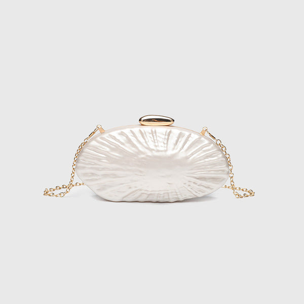 Oval pearl-finish shell clutch bag with gold-tone clasp and removable gold link chain strap, detail view 7