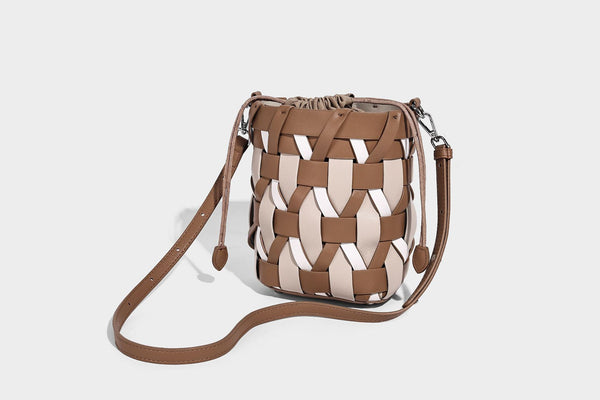 Small woven lattice bucket bag in tan and cream leather-look strips with drawstring top and detachable crossbody strap