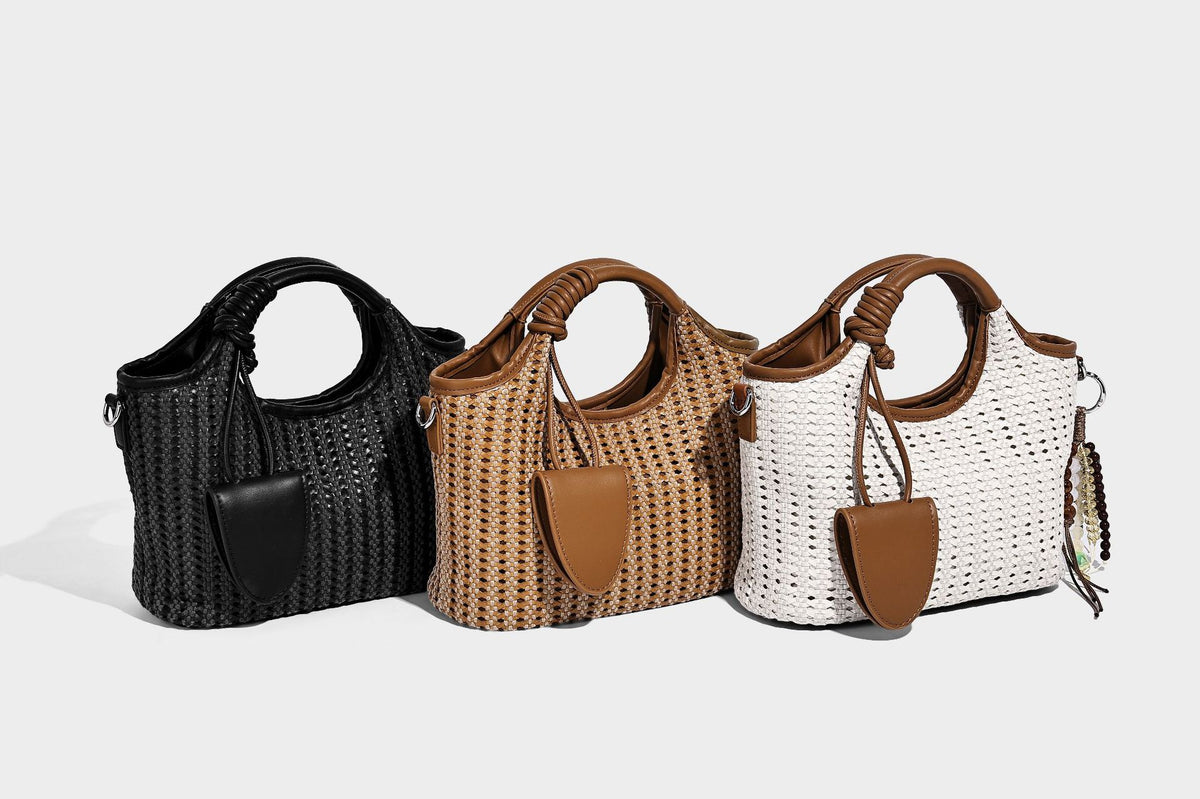 Small structured woven tote crossbody bag with ring top handle, leather-look brown trim, front patch pocket, and detachable