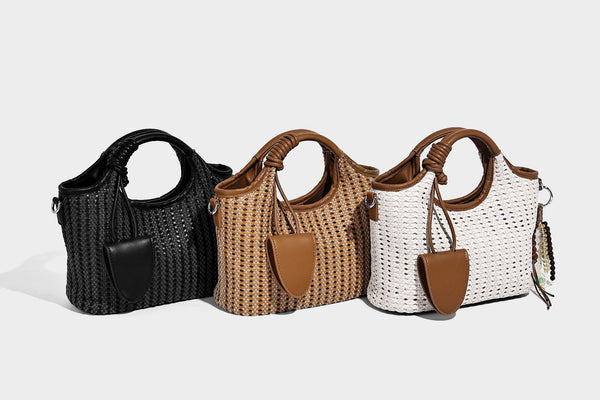 Small structured woven tote crossbody bag with ring top handle, leather-look brown trim, front patch pocket, and detachable