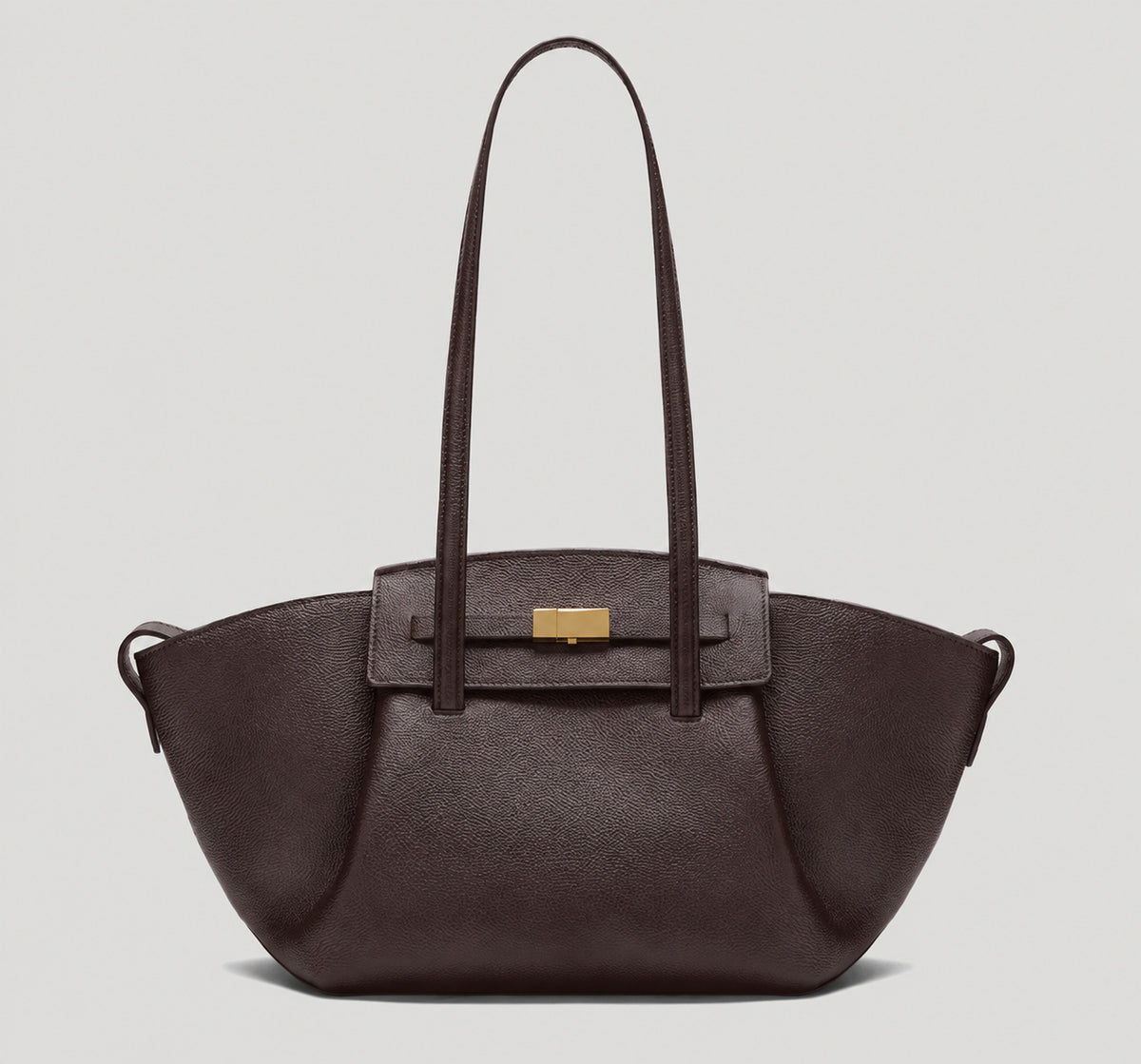 Black pebbled trapezoid tote bag with gold turn-lock hardware and double top handles, detail view 8