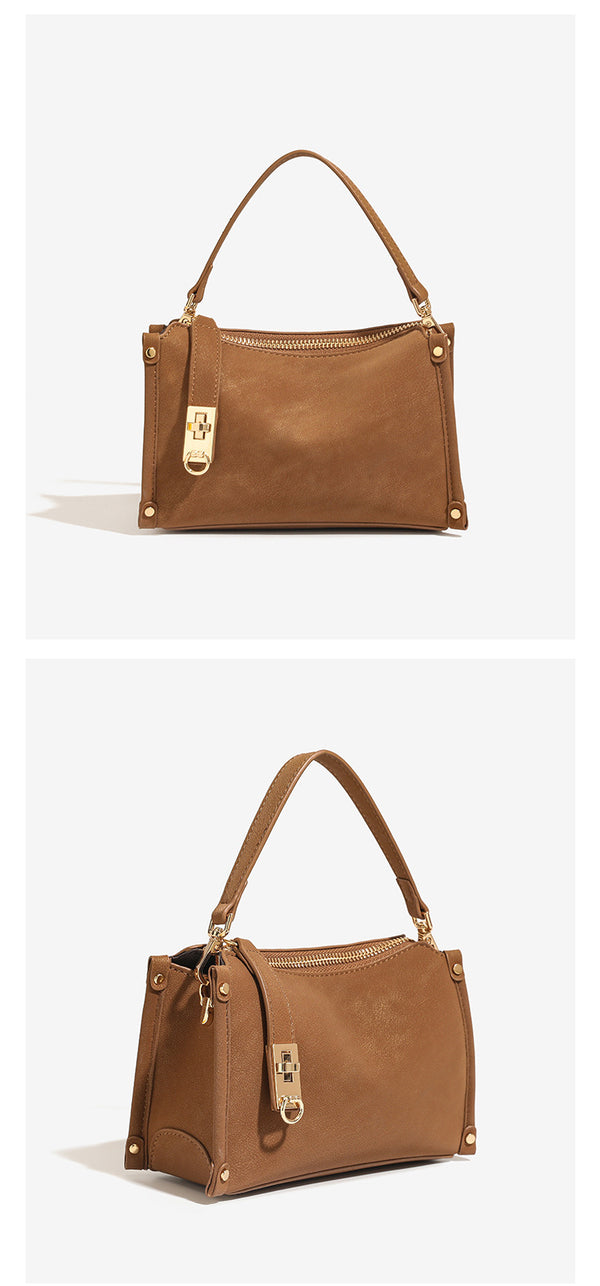 Small structured square handbag in deep dark brown matte pebbled finish with gold-tone turn-lock clasp, top zipper, corner
