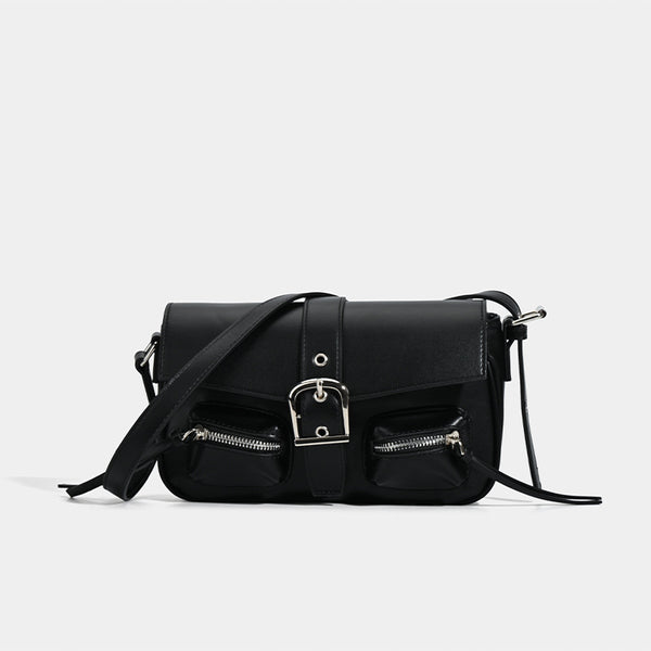 Structured flap crossbody bag with front buckle strap and dual zip pockets in smooth leather-look finish with silver-tone