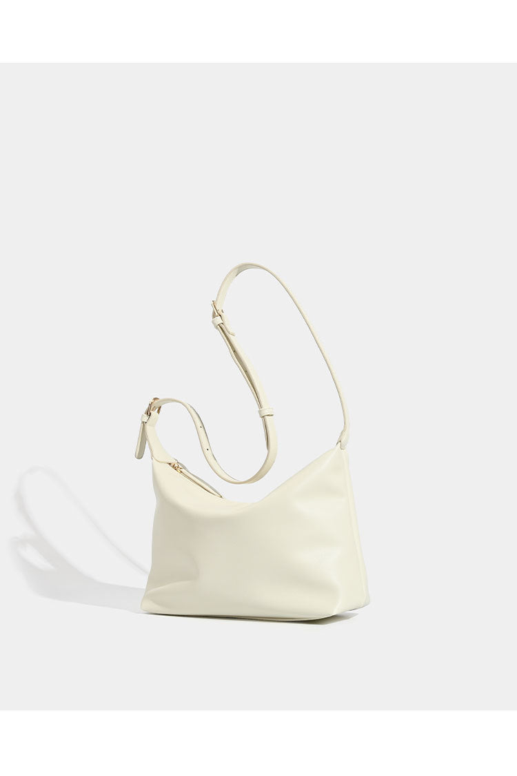 Soft slouchy zip shoulder crossbody bag with smooth matte leather-look finish and gold-tone hardware, detail view 9