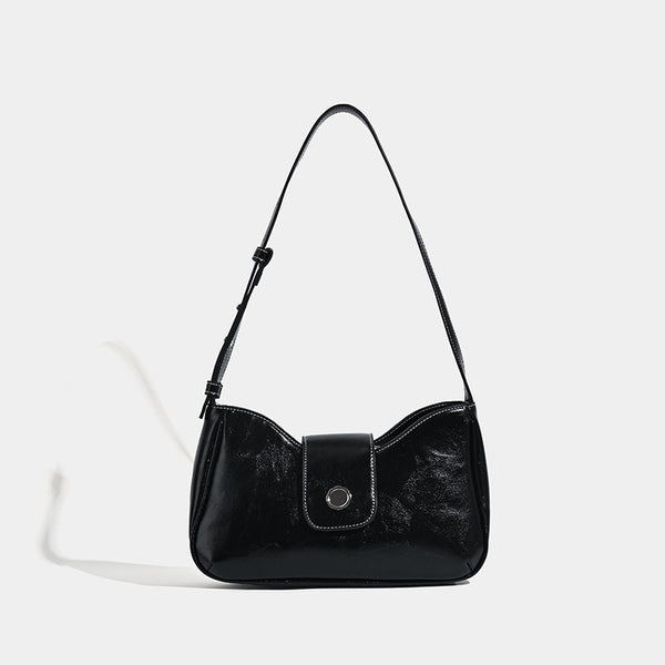 Compact glossy leather-look shoulder bag with round metal snap closure and contrast stitching, detail view 6