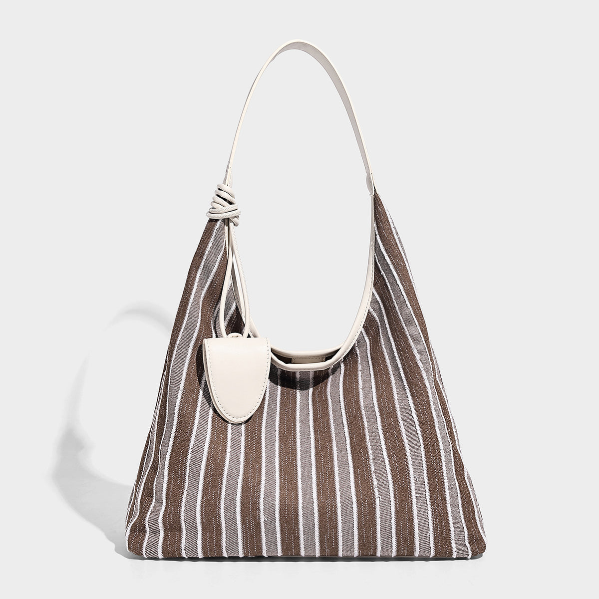 Slouchy striped canvas hobo shoulder bag with cream trim and long knotted strap, detail view 4