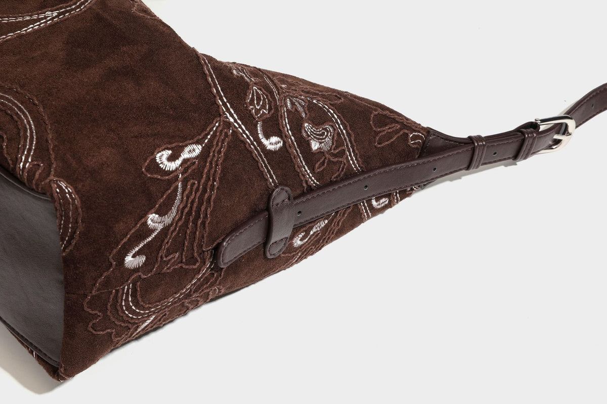 Deep chocolate suede-look hobo shoulder bag with tonal paisley floral embroidery, smooth dark leather-look trim, top zip