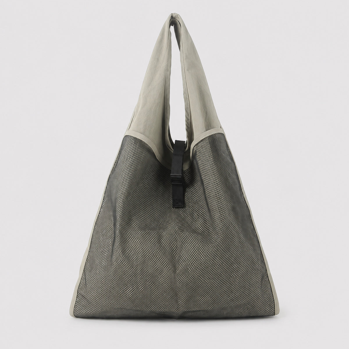 Oversized triangular mesh tote bag with matte olive-khaki fabric straps and trim, dark open-weave mesh body, matte black