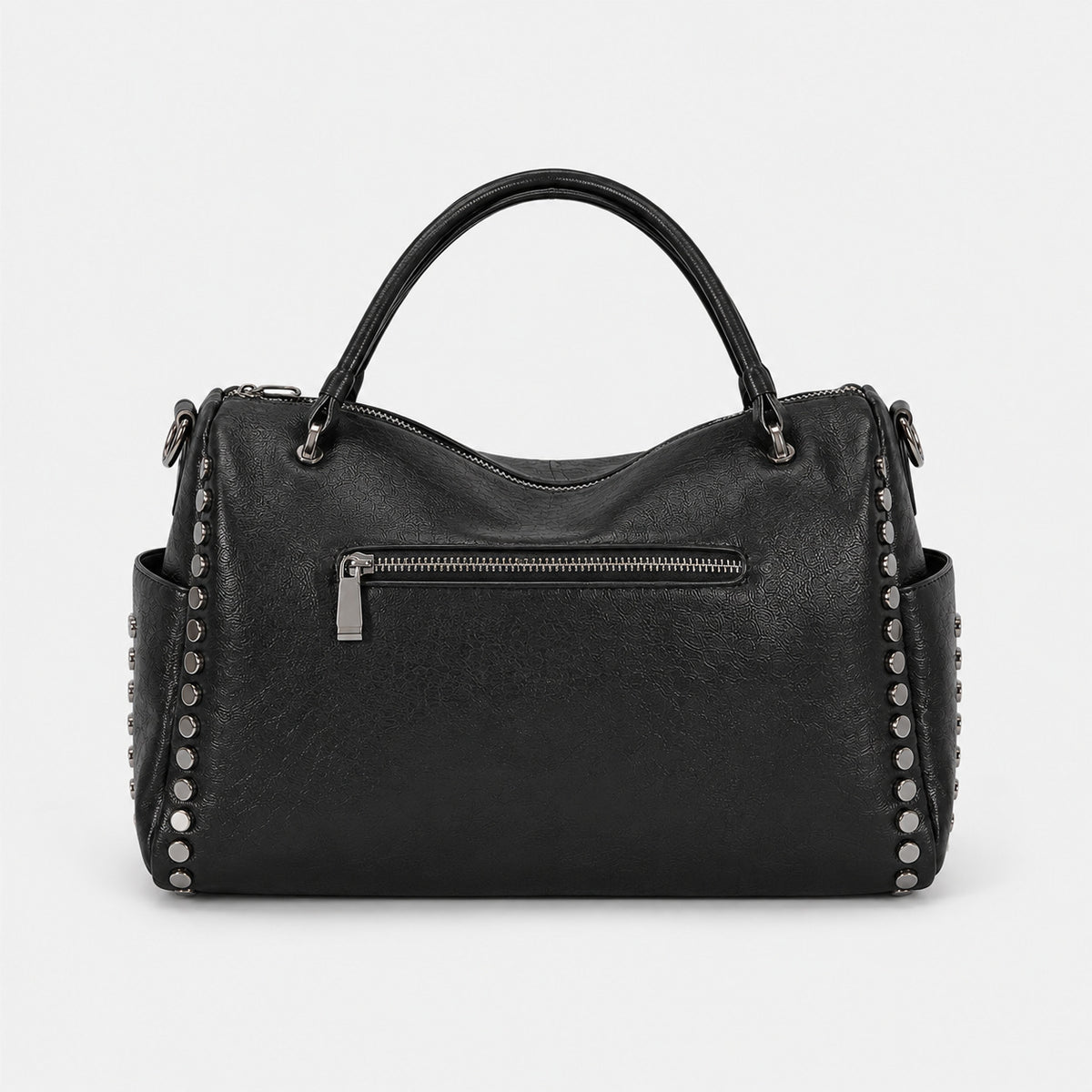 Black leather-look satchel bag with gunmetal rivet trim, grid-stitched paneling, dual rolled top handles, and curved zip