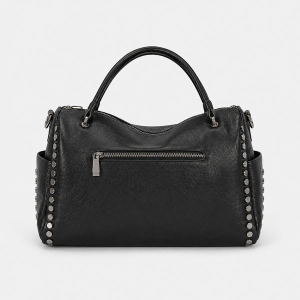 Black leather-look satchel bag with gunmetal rivet trim, grid-stitched paneling, dual rolled top handles, and curved zip