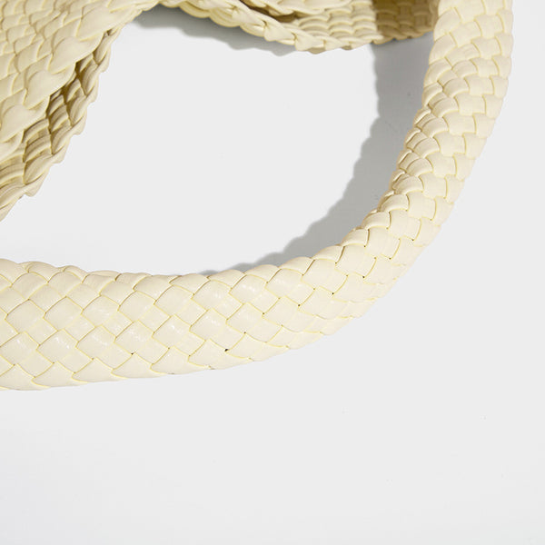 Soft hand-woven slouchy hobo tote bag with knotted tassel charm and single looped shoulder strap, detail view 36