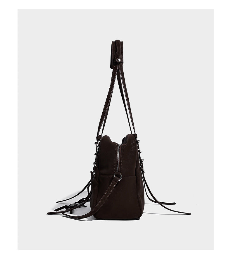 Structured rectangular matte suede-like shoulder bag with silver-tone hardware, zip closure, double top handles, and, detail