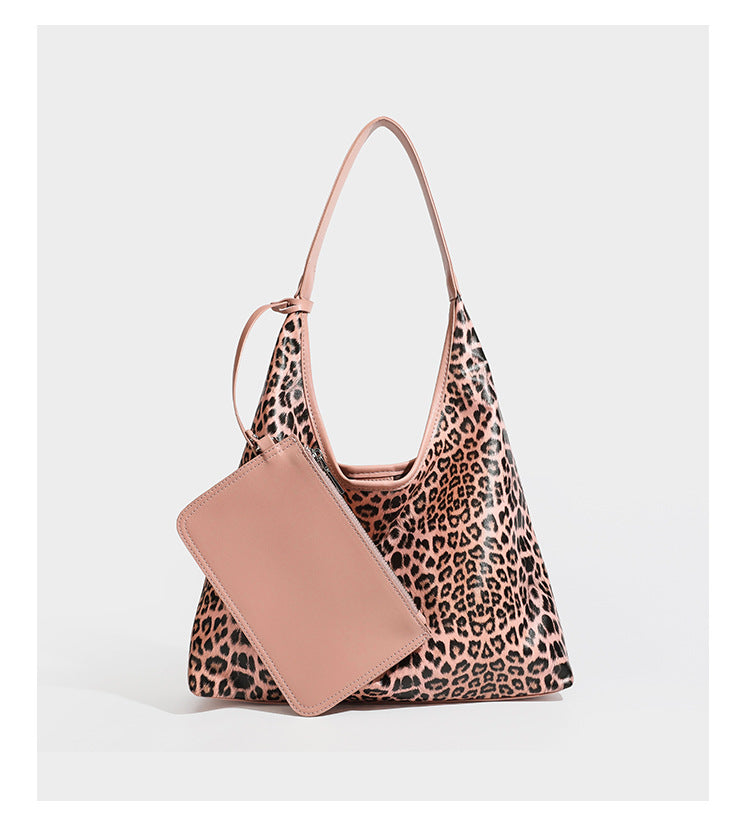 Glossy leopard-print slouchy shoulder bag with long strap and detachable tan zip pouch, detail view 16