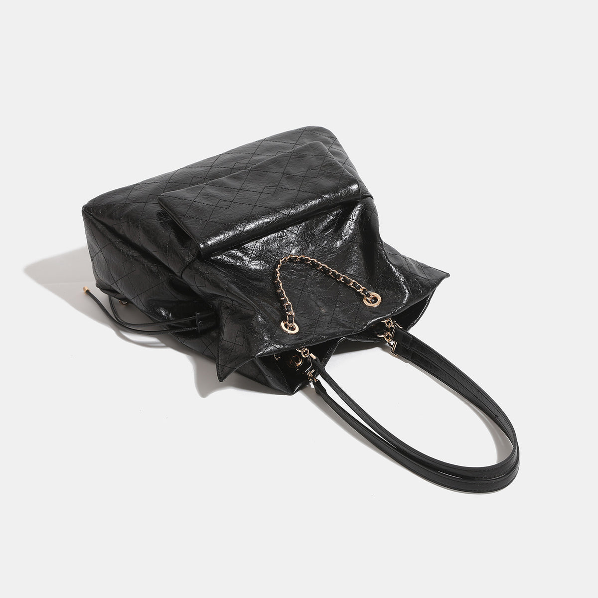 Quilted crinkled leather-look convertible tote backpack with gold-tone chain handles and drawstring closure, detail view 4